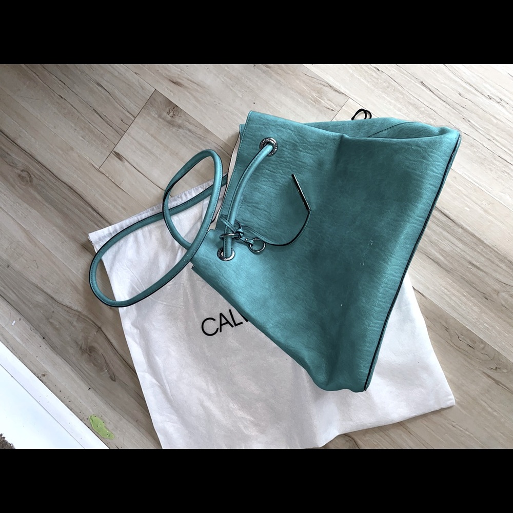 Name brand purse in teal